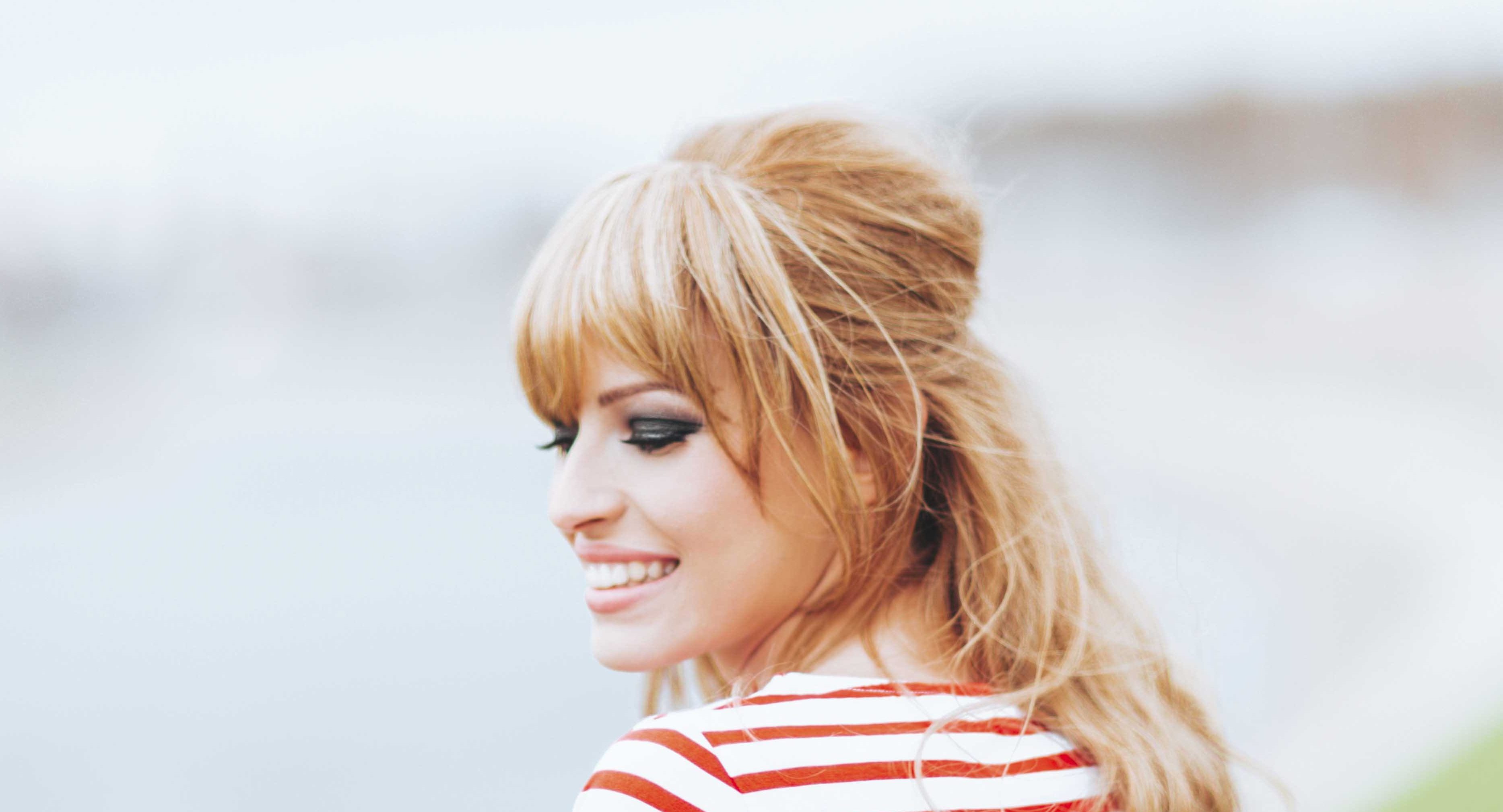 Medium length hair cuts: All Things Hair - IMAGE - layered fringe blonde wavy