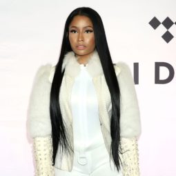 Nicki Minaj at the TIDAL X: 1015 event with long black hair wearing an all white outfit