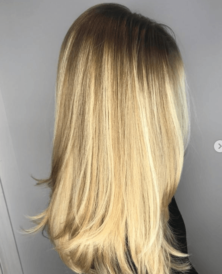 side view image of a woman with long blonde hair - blonde brown hair