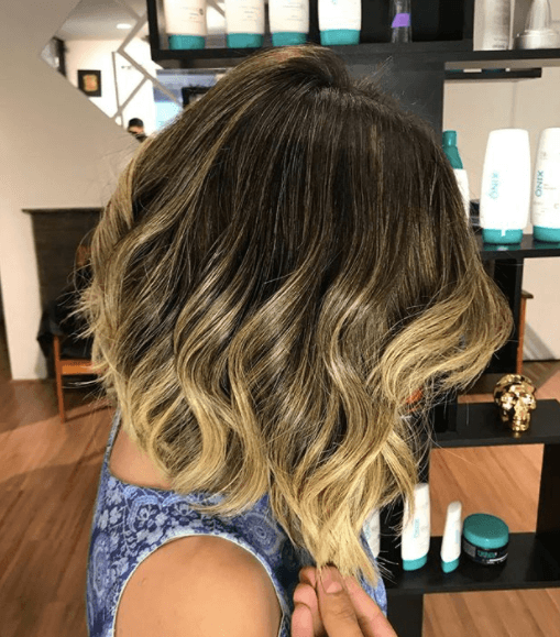 side view image of a woman with an ombre bob hairstyle - blonde brown hair