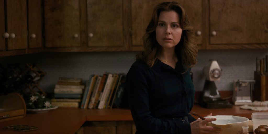 A still of Karen from Stranger Things season one with her hair worn neat and down