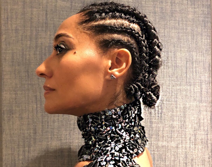 shot of tracee ellis ross with cornrow hairstyle, wearing glittery dress posing
