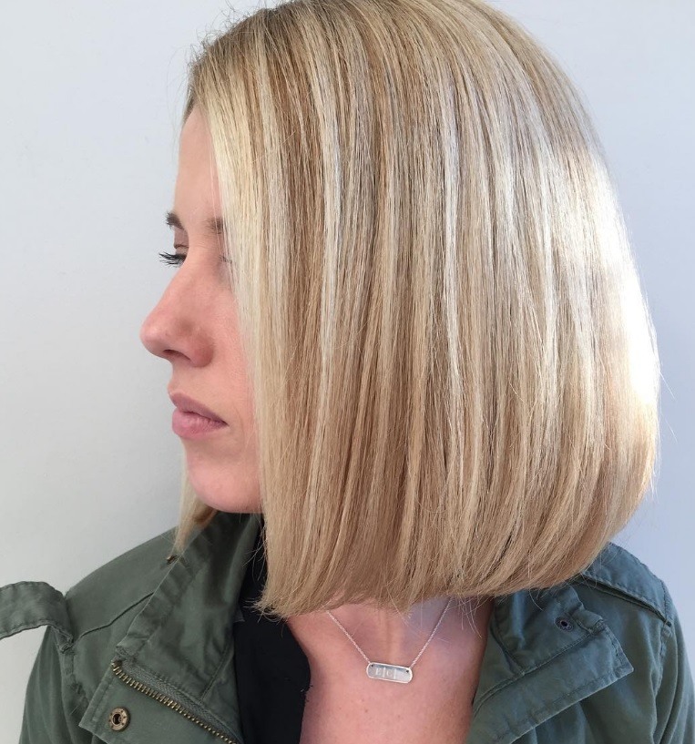 Short trendy hairstyles: woman with classic blonde bob and highlights
