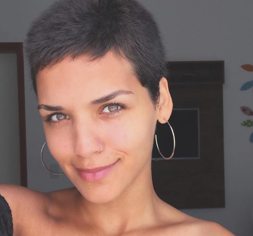 Short edgy haircuts from Instagram: tanned girl with dark hair cropped very short