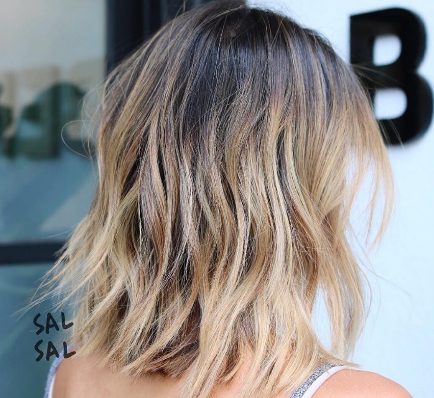 Cool hairstyles for short hair: Woman with a sun-kissed textured bob
