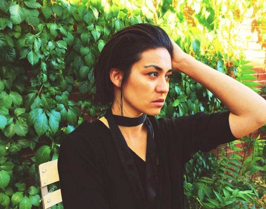 Cool short hairstyles: Asian woman with slicked back bob brown hair