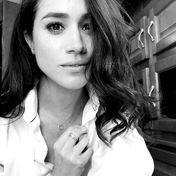 black and white Insta post of Meghan Markle with casual curls