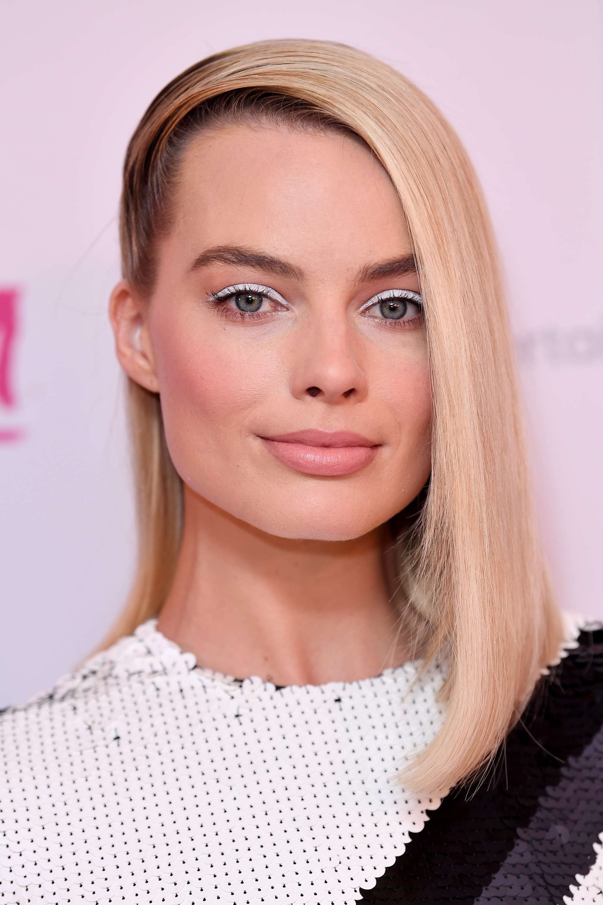 Margot Robbie with long blonde blunt haircut