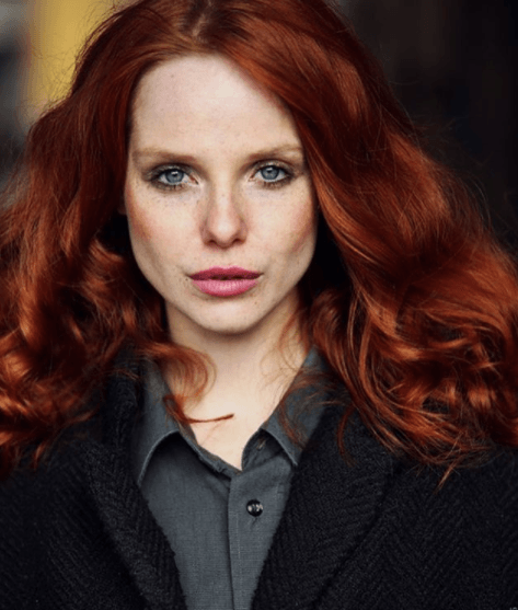 front view image of a model with dark red fiery hair