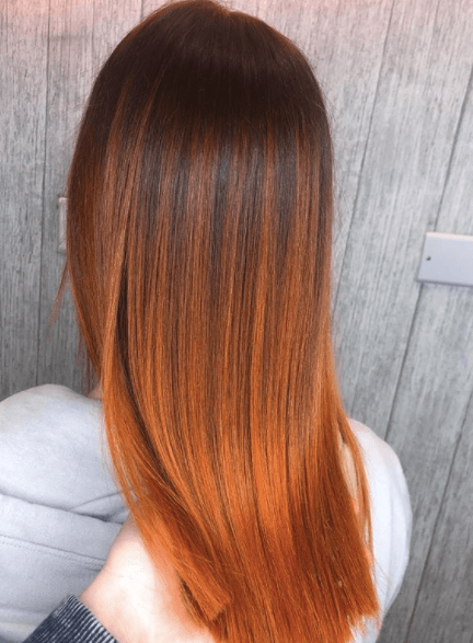 back view of a woman with fiery red hair