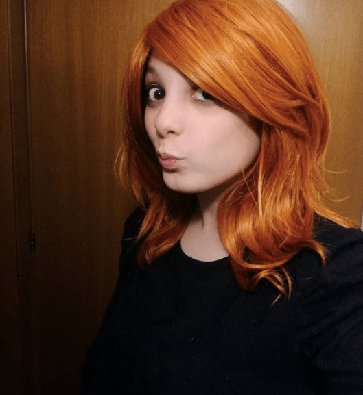 front view image of a woman with red hair