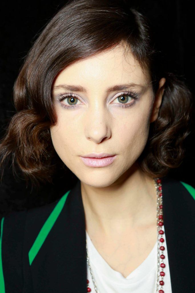 cute short hair cuts: woman with dark hair and big curls in short hair