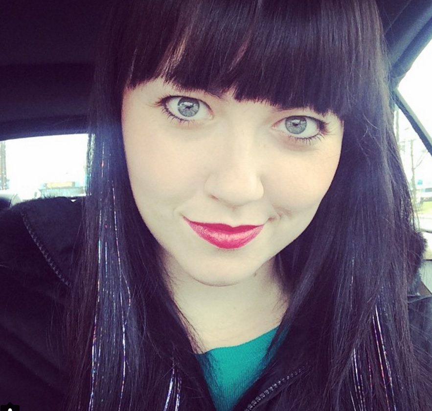 woman with long fringe dark hair and tinsel hair