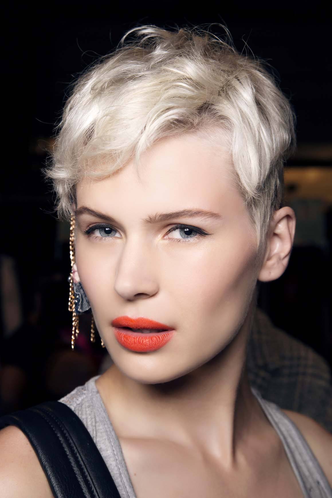 best short haircuts for women: model with platinum blonde pixie hair