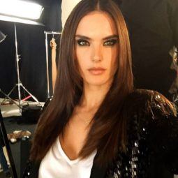 Alessandra Ambrosio backstage with brunette long straight hair wearing a white t-shirt