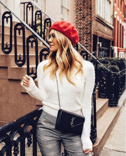 front view of wavy blonde hair with red beret