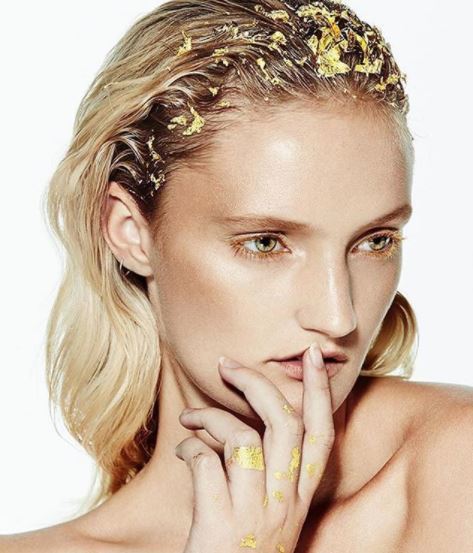 front view of blonde model with hair down and gold foil roots