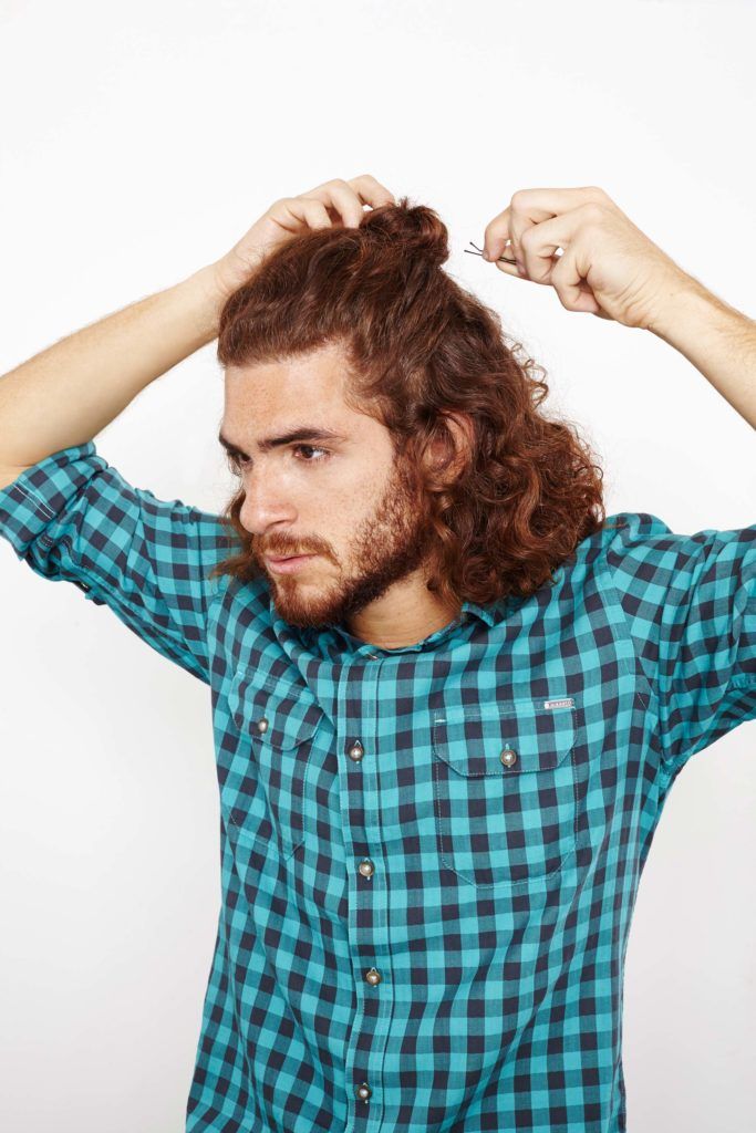 half up top knot bun curly hair