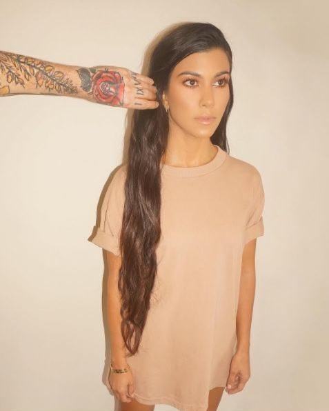 Straight hairstyles for long hair: Kourtney Kardashian wearing a long T-shirt with really long hair