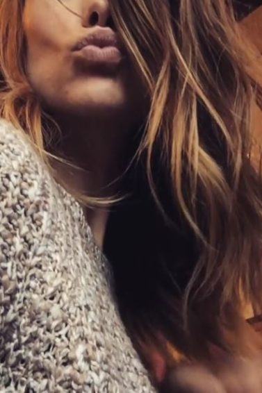 Olivia Wilde taking a selfie showing off her new wavy haircut and blonde highlights