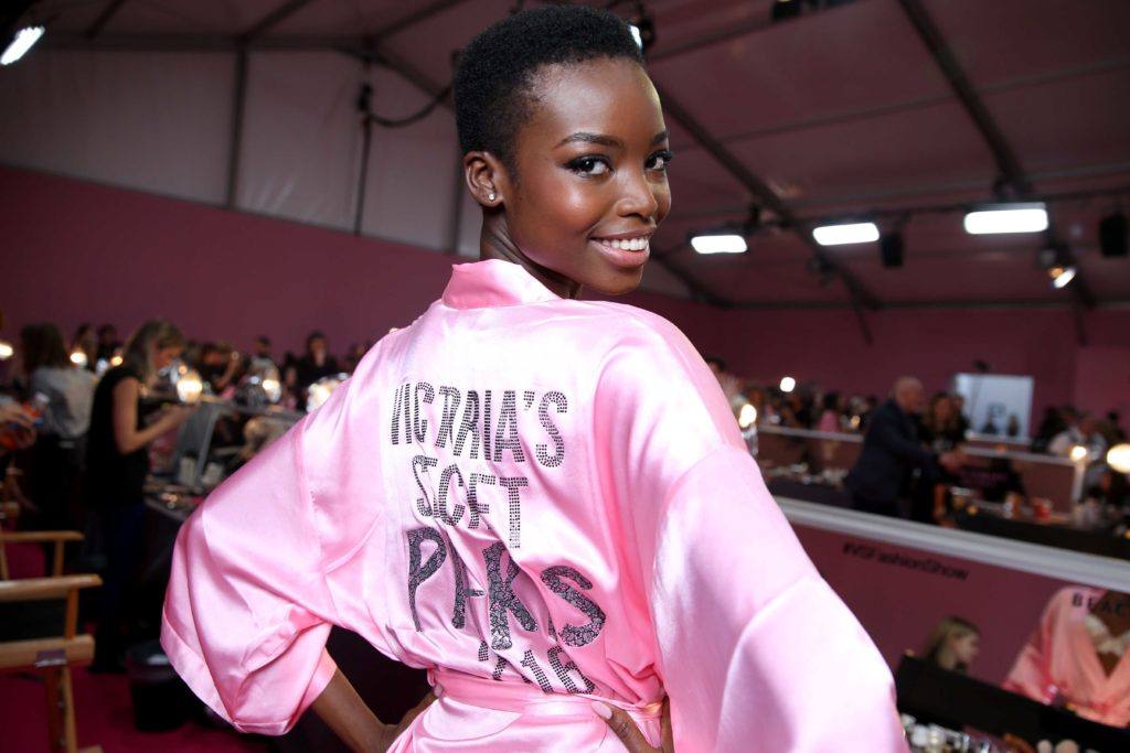 close up shot of Maria Borges with teenie weenie afro hairstyle, wearing pink victoria secret robe at the victora secret show