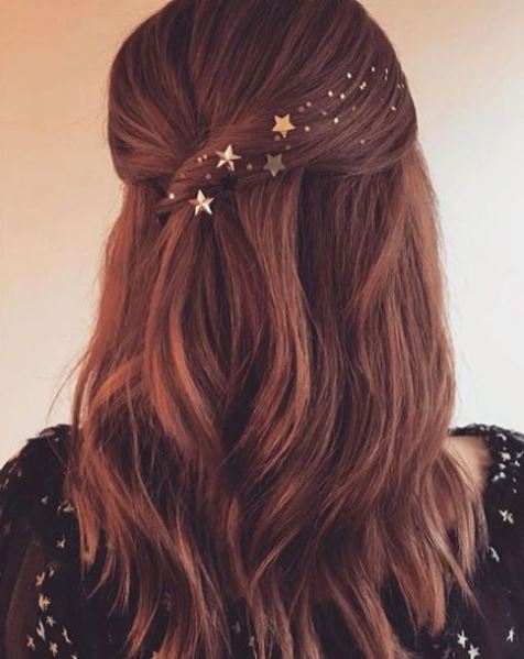 back view of brown long wavy hair with star hair accessories pinned back hair