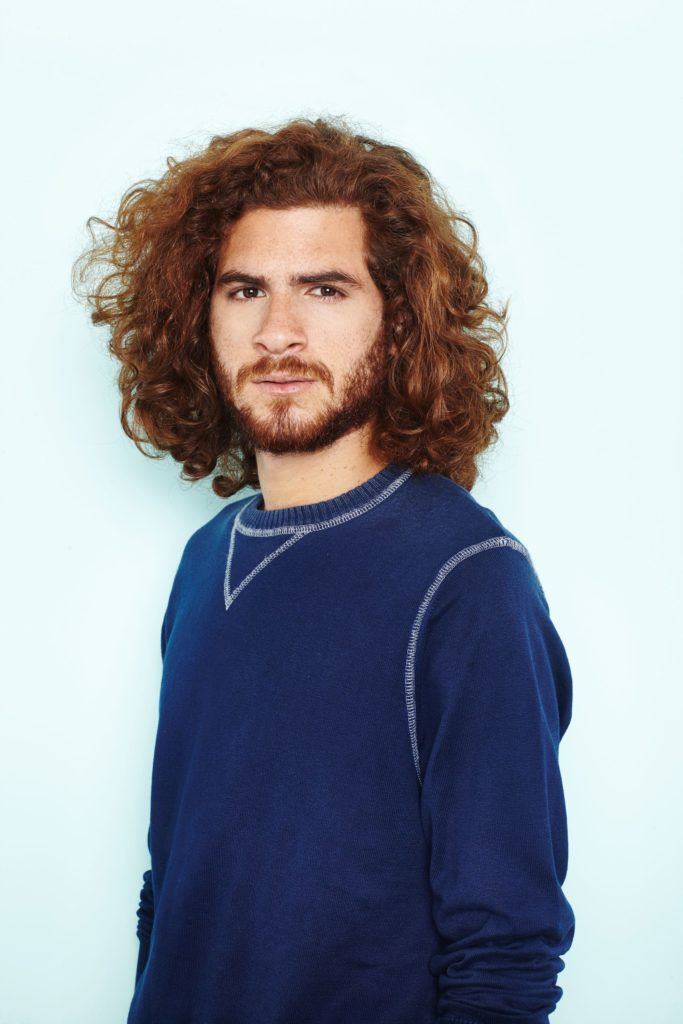 man bun hairstyle: All Things Hair - IMAGE - mens hairstyle curly brown hair