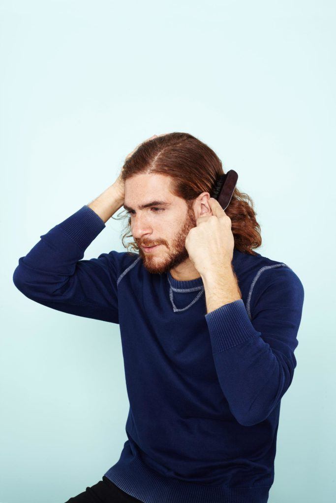 man bun hairstyle: All Things Hair - IMAGE - mens hairstyle brushing hair