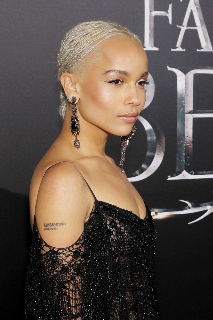 close up shot of zoe kravitz with blonde micro plaits on the red carpet