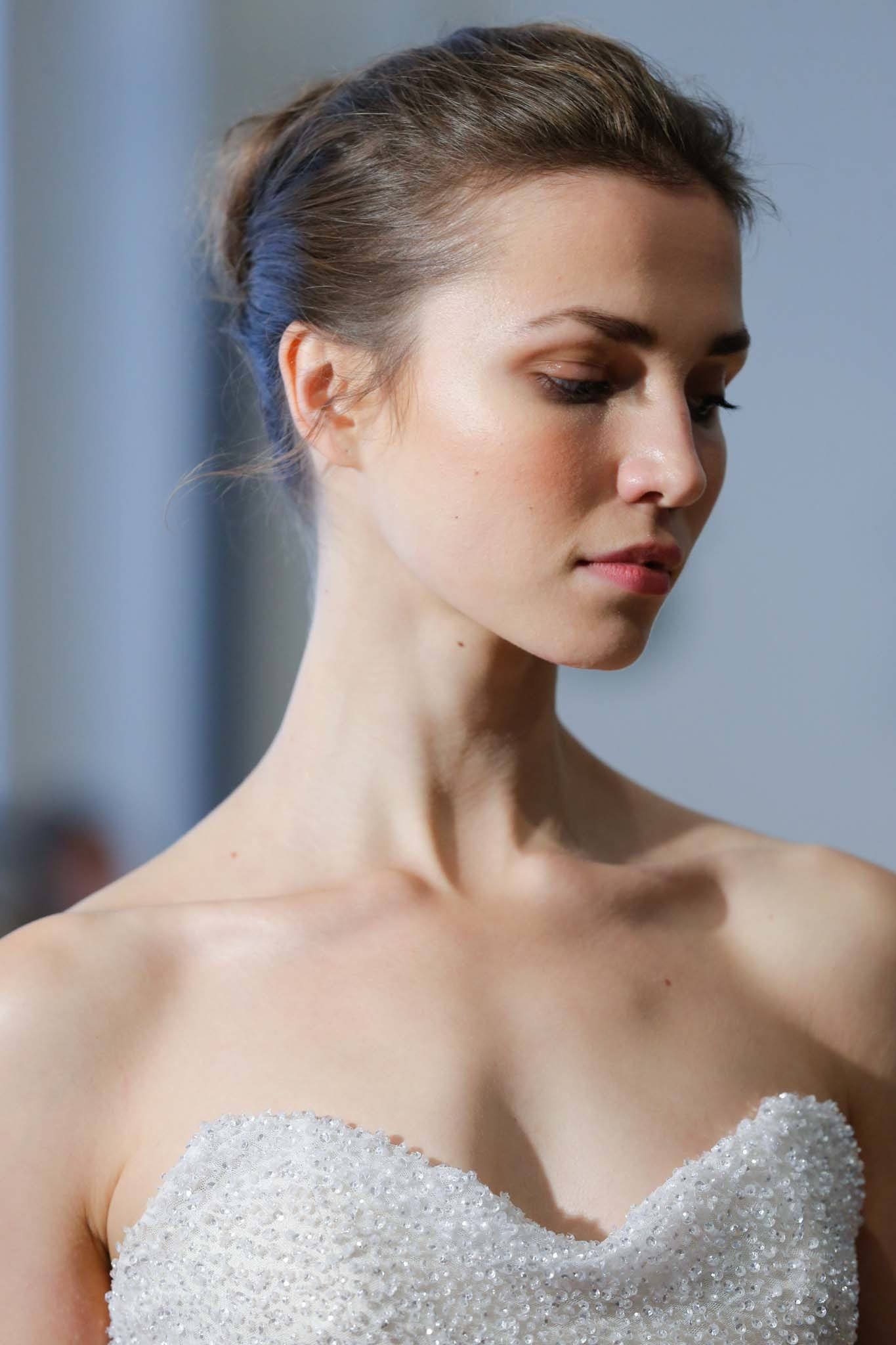 Wedding updos: A brunette with a ballerina-inspired bun hairstyle Carol Hannah FW 17