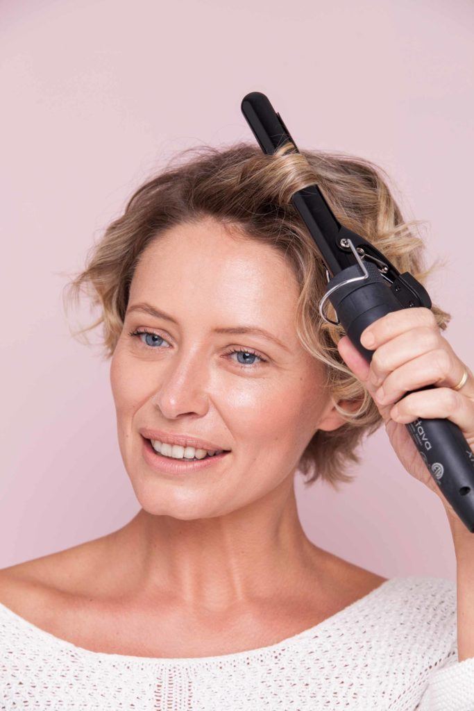 blonde-haired woman shows us how to get short hair in a tutorial