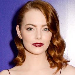 Emma Stone with Hollywood waves red bronze hair