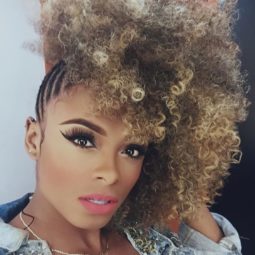 Fleur East with curly afro