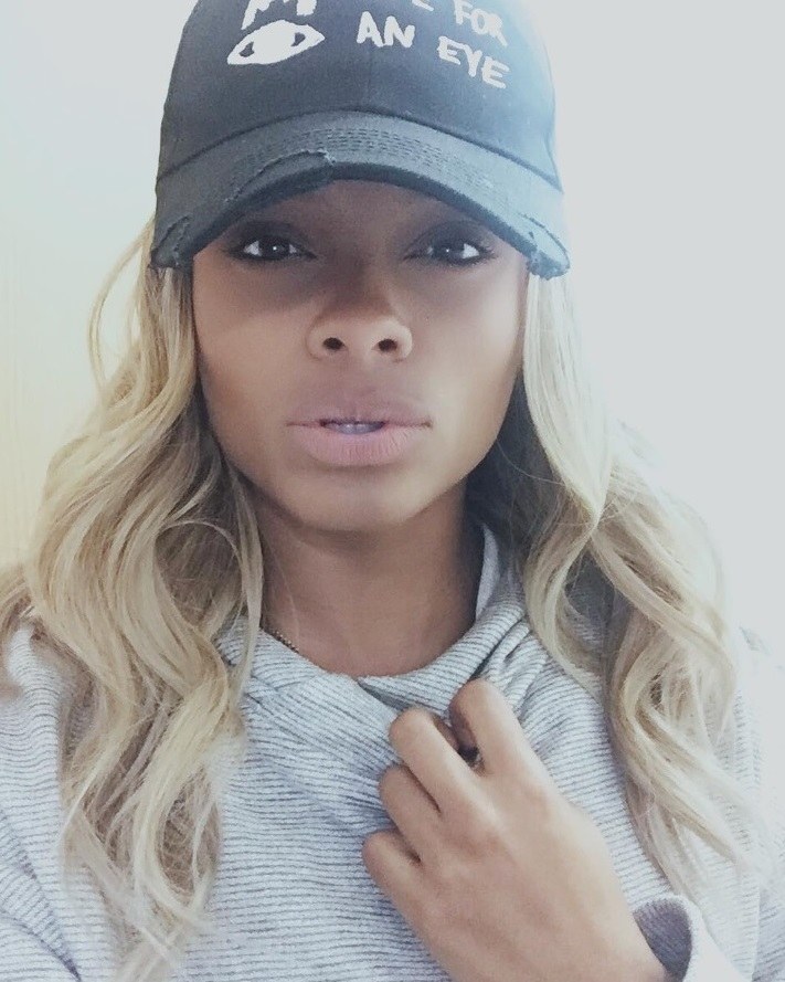 Fleur East with straightened blonde hair