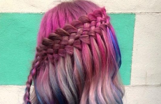 colorful waterfall hairstyle in long wavy pink and blue hair