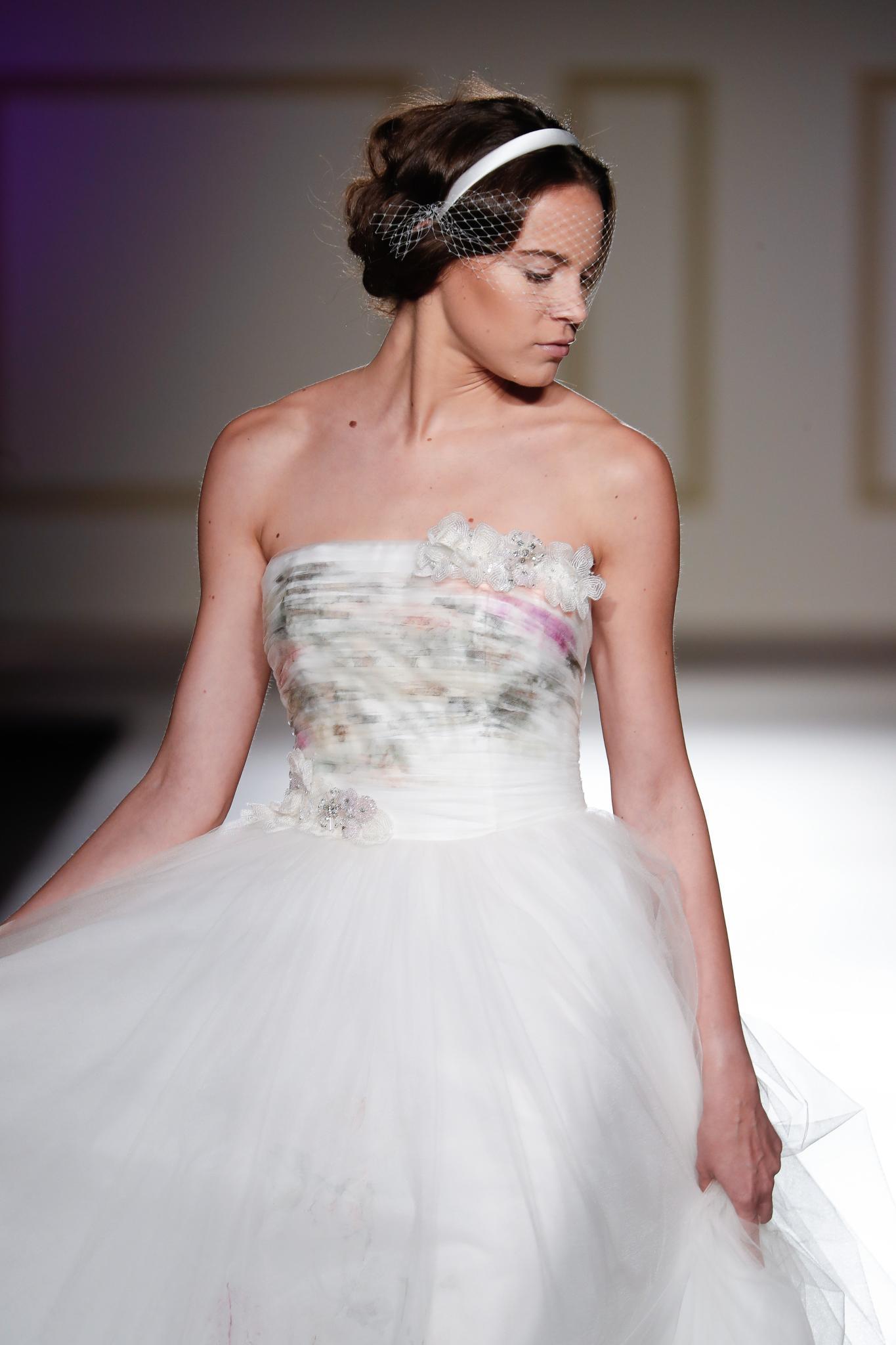 Wedding updos: Brunette model with hair tucked chignon/headband roll Blumarine 17