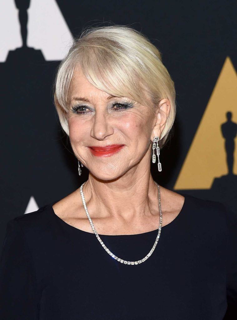 Helen Mirren on the red carpet with her white blonde hair cut into a bob and styled smooth