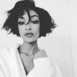 Jclose up shot of jourdan dunn with dark chin length hairstyle, wearing robe and posing