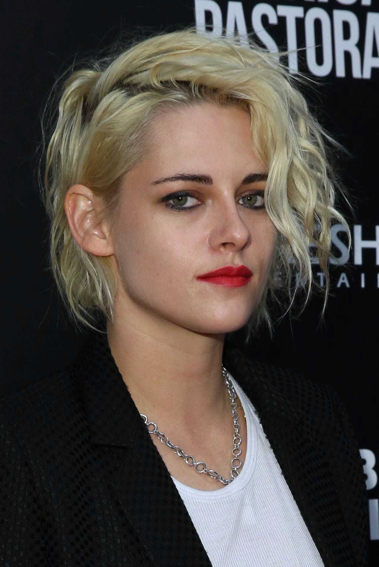 Kirsten Stewart with grungy bob hairstyle wearing red lipstick