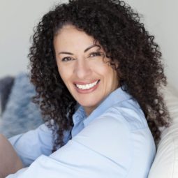 mature woman with curly brown hair