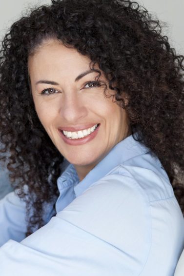 mature woman with curly brown hair