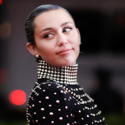 Miley Cyrus with a sleek crop in jewel studded dress