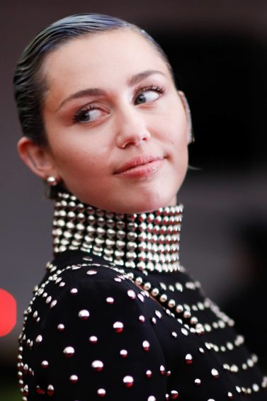 Miley Cyrus with a sleek crop in jewel studded dress