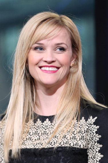 Reese Witherspoon with side swept hairstyle and long dress