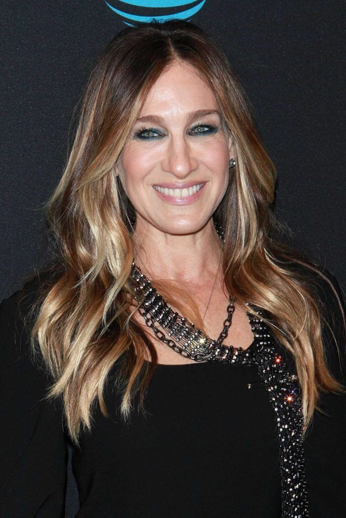 Sarah Jessica Parker on the red carpet with her long wavy balayage hair worn down