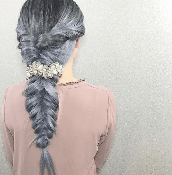 back view of a womans hair with a grey fishtail braid - prom hairstyles for long hair