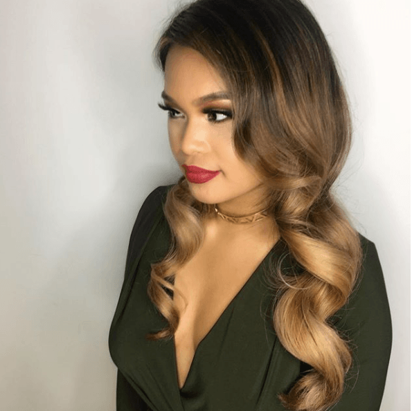 front view of a woman with sleek waves - prom hairstyles for long hair