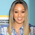 sister sister actress tia mowry with sleek straight ombre light brown to blonde hair