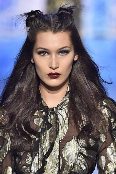 bella hadid with space bun wavy hairstyle on the anna sui runway