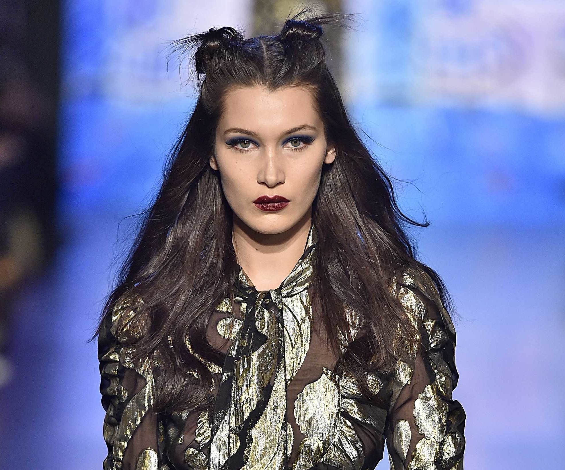 close up shot of bella hadid with space bun wavy hairstyle on the anna sui runway
